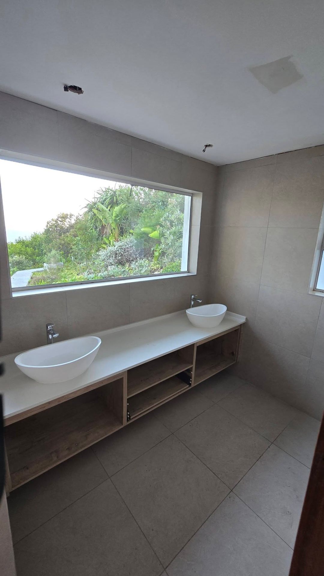 Modern double vanity with garden-view window