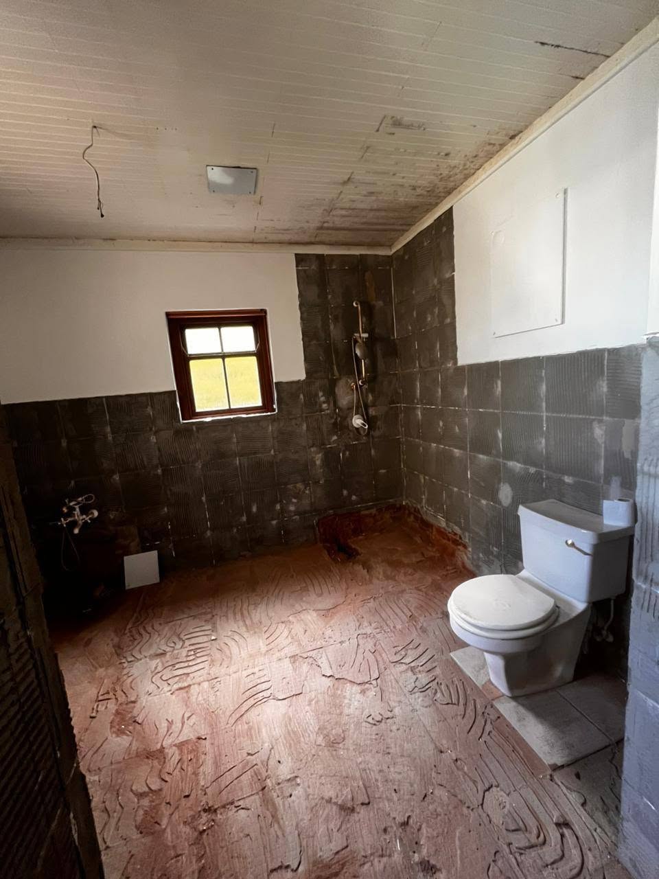 Stripped bathroom mid-renovation
